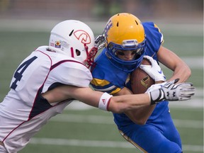 Saskatoon Hilltops receiver Connor Graham runs the ball during the home opener at SMF Field in Saskatoon, Sk on Saturday, August 25, 2018.