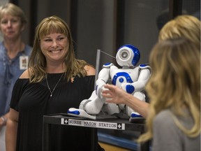 Gale Gariepy with a humanoid robot, which is intended to bring young patients comfort and brighten their spirits while in hospital, that was a posthumous tribute to the pediatric unit at Royal University Hospital with the help of Make-A-Wish recipient and her son, Mason Gariepy during a media event at RUH in Saskatoon, Sask. on Wednesday, September 5, 2018.