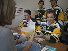 Humboldt Broncos forward Jackson Kobelka gets his blood type tested during the  Hockey Gives Blood event at Canadian Blood Services in Saskatoon, Sk on Saturday, September 15, 2018.