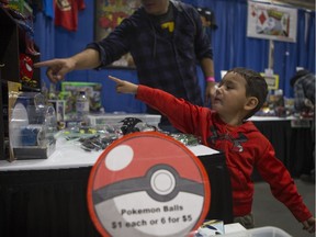 Castile Sanderson points to a toy during the Saskatchewan Entertainment Expo at Prairieland Park in Saskatoon, Sk on Saturday, September 15, 2018.