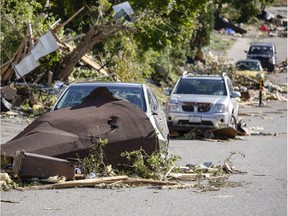 Cars on Rue Jomonville are show severe damage Saturday, September 22, 2018 after a tornado touched down late Friday.