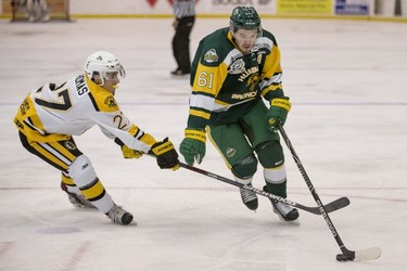 Humboldt Broncos forward Michael Clarke moves the puck past Estevan Bruins forward Isaiah Thomas in Warman, SK on Tuesday, September 25, 2018. The Broncos, who are rebuilding their team after 16 people died in an April 6 bus crash beat the Estevan Bruins 6-2 Tuesday at the Legends Centre in Warman. Humboldt is now 3-2, as is Estevan. The SJHL wraps up its four-day series of games in Warman with two contests Wednesday: Nipawin against Notre Dame at 11 a.m., and Humboldt against Melville at 2 p.m.