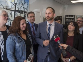 Saskatchewan NDP leader Ryan Meili surrounded by members of the party's caucus in Saskatoon last month.