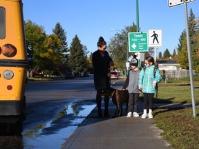 Kelly Sikorski and her children Benson and Taylor walk to school together on Sept. 25, 2018. They walk together almost every day.