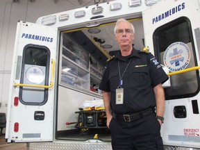 Gerry Schriemer, the Chief Operating Officer and Chief of EMS with Medavie Health Services West, stands with a Medavie Ambulance at the service's main office in Saskatoon's C.N. Industrial Neighbourhood on Sept. 26, 2018. Schriemer, a veteran paramedic, says the service is aware of ambulance shortages in Saskatoon, but say they're rooted in systematic offload delays that are taking place inside the walls of Saskatoon hospitals.