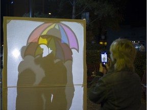 Avery Arseneau takes a photograph of attendants playing with one of many art instillations during the fourth annual Nuit Blanche Festival celebrating art in Saskatoon, SK on Saturday, September 30, 2017.