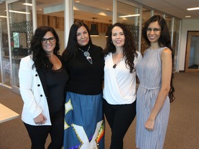 Alicia Soulier of SalonScale, left, Heather Abbey of Indig, Serese Selanders of ORA and Sheila Maithel of Brillest Better Projects at the co.labs tech incubator office in Saskatoon.