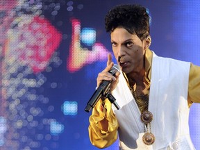 This June 30, 2011 file photo shows US singer and musician Prince performing on stage at the Stade de France in Saint-Denis, outside Paris. - The estate of prolific late pop icon Prince made more than 300 songs from his later career available on digital download and streaming services for the first time on Friday, August 17, 2018. The tracks come from 23 albums -- from 1995's "The Gold Experience" to 2010's "20Ten" -- that have been launched online as part of a deal struck with Sony's Legacy Recordings. There is also a new 37-track compilation called "Prince Anthology 1995-2010," made up of highlights from the 23 albums.