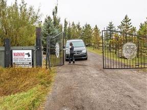 A vehicle leaves a rural property on Sunday that was the scene of a fatal attack near Langdon, east of Calgary.