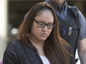 Cheyann Peeteetuce entering Queen's Bench Court in custody for sentencing arguments on May 13,  2015