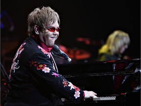 Elton John plays to the crowd at Saskatoon's Credit Union Centre on May 10, 2011