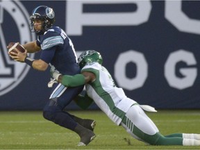 Riders defensive end Willie Jefferson sacks Toronto quarterback McLeod Bethel-Thompson during the first play of Saturday's game at BMO Field.