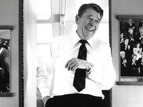 A photo of Ronald Reagan laughing at the punchline of his own joke aboard Air Force One. Reagan may have tasked his CIA with digging up the era's best Soviet jokes.
