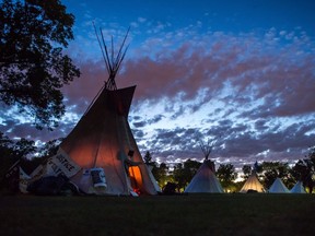 Teepees stand together at the Justice for Our Stolen Children camp across from the Saskatchewan Legislative Building in late June, 2018.
