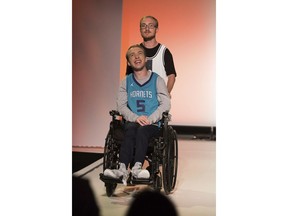 The Runway of Dreams collection is modeled Wednesday, Sept. 5, 2018, during Fashion Week in New York. The runway show featured models with disabilities wearing adaptive clothing for children and adults.(AP Photo/Kevin Hagen).