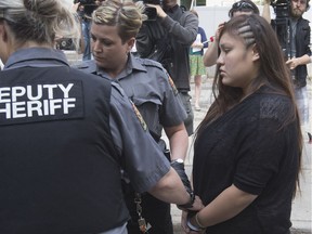 Cheyann Chrystal Peeteetuce, centre, was sentenced in the deaths of Sarah Wensley and James Paul Haughey, leaving Queens Bench Courthouse, Friday, June 12, 2015.