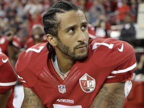 In this Sept. 12, 2016 file photo, San Francisco 49ers quarterback Colin Kaepernick kneels during the national anthem before a game against the Los Angeles Rams.