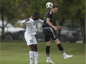 SASKATOON,SK--SEPTEMBER 01 0901-SPORTS-HUSKIES MENS SOCCER- Huskies Eklor-Dourde Mieyefa fights for the ball with Alberta Golden Bears Easton Ongaro  during the Canada West menÕs soccer home-opener at Nutrien Park in Saskatoon, Sk on Saturday, September 1, 2018.