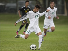 Huskies forward Nikolas Baikas goes to kick the ball during the Canada West men's soccer home opener at Nutrien Park in Saskatoon on Sept. 1, 2018.