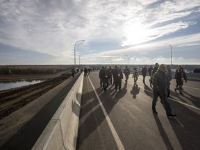 SASKATOON,SK--OCTOBER 02/2018-1003 News Chief Mistawasis Bridge opening- People walk across the Chief Mistawasis Bridge prior to a ceremony for the opening in Saskatoon, SK on Tuesday, October 2, 2018.