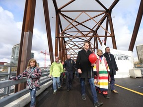 Mayor Charlie Clark, Central Urban Metis Federation Inc. president Shirley Isbister, and MLA Ken Cheveldayoff were at the front of the party walking from the north side of Saskatoon's newly opened Traffic Bridge on Oct. 2, 2018.