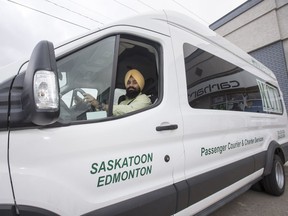 Harkanwal Singh, owner of KCTI a bus company that is picking up GreyhoundÕs rout between Saskatoon and Edmonton beginning next month, stans for a photograph with one of his buses in Saskatoon, SK on Monday, October 29, 2018.