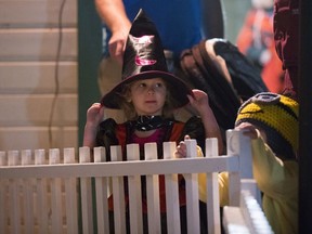 Angela Trapp, age 2, checks out a grave yard display during the annual Boo Town Halloween event at Boomtown inside the Western Development Museum in Saskatoon, Sask. on Monday, October 30, 2017.