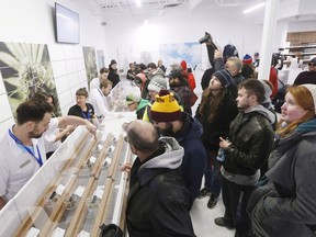 People check out the sample counter at a cannabis store in Winnipeg, Man., on Oct. 17.