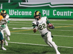 Kyle Borsa of the University of Regina Rams runs the ball Friday at Mosaic Stadium against the University of Alberta Golden Bears.
