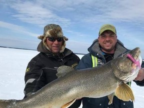 Kyle Borysiuk (right) poses for a photo with his father Allan (left) and the 47-inch Lake Trout Kyle caught north of La Ronge. Photo submitted by Kyle Borysiuk.