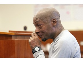 FILE - In this Aug. 10, 2018, file photo, plaintiff DeWayne Johnson reacts after hearing the verdict in his case against Monsanto at the Superior Court in San Francisco. A Northern California judge has upheld a jury's verdict finding Monsanto's weed killer caused the groundskeeper's cancer, but slashed his $287 million award to $78 million. San Francisco Superior Court Judge Suzanne Bolanos ruled Monday, Oct. 22.