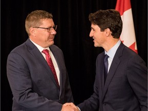 Prime Minister Justin Trudeau (right) meets with Saskatchewan Premier Scott Moe in Saskatoon on Sept. 12, 2018