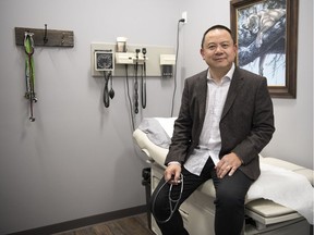 Physician Winston Lok sits in his medial office located inside the Gardens Community Health Centre in Regina.