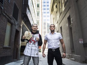Featherweight champion Max Holloway, left, and unbeaten challenger Brian Ortega pose for a photograph before their upcoming UFC 231 title fight in Toronto on Wednesday, October 10, 2018.