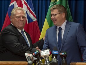 Ontario Premier Doug Ford, left, and Saskatchewan Premier Scott Moe in Saskatoon on Thursday, October 4, 2018.