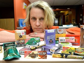 Donna Pasiechnik, manager tobacco control for Saskatchewan division of the Canadian Cancer Society with a variety of flavoured tobacco products in Regina, Sask. on October 07, 2013.