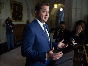 Conservative Leader Andrew Scheer speaks reporters as he responds to the USMCA trade deal, in the foyer of the House of Commons on Parliament Hill, in Ottawa on Monday, Oct. 1, 2018.