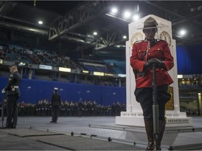 A member of the RCMP stands guard during one of Canada's largest indoor Remembrance Day services at SaskTel Centre in Saskatoon, Sask. on Saturday, November 11, 2017.