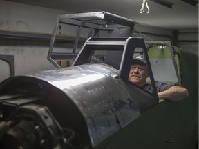 Don Bradshaw in the cockpit of a Second Wold War-vintage Messerschmitt Bf 109G-6 he is restoring in his Saskatoon garage.