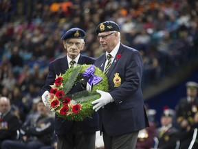 Participants lay a wreath during the Remembrance Day ceremonies at SaskTel Centre in Saskatoon,Sk on Sunday, November 11, 2018.