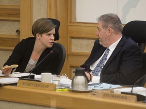 City councillor Hilary Gough speaks to councillor Randy Donauer during the budget deliberations at City Hall in Saskatoon,Sk on Monday, November 26, 2018.