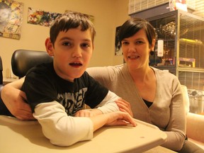 Lexie Craig and her 10-year-old son, Henry Craig-Van Vliet at their 25th Street West home on Thursday, Nov. 29, 2018. A wheelchair, used to help Henry get around, was stolen from the family's vehicle on Nov. 25, 2018. Police are asking for the public's help to have the wheelchair returned.