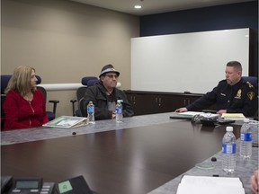 Rhonda Beaudin and Kim Beaudin speak to Chief Troy Cooper at the Saskatoon Police headquarters on Friday, November 16, 2018.