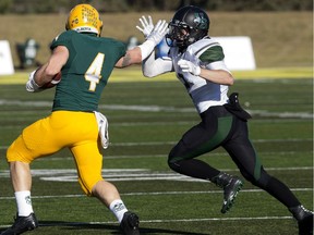 Bowan Lewis (right) is the Canada West defensive player of the week.