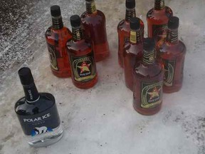 Further investigation revealed eight 66-ounce bottles of whiskey and one 66-ounce bottle of vodka in the vehicle, which were all seized.