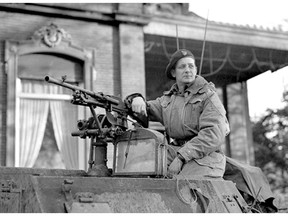 Lt.-Col David Vivian Currie in the turret of a tank like the one he commanded while winning the Victoria Cross in France during the Second World War.