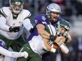 Huskies' tailback Tyler Chow runs the ball during Saturday's Mitchell Bowl loss to Western Ontario.