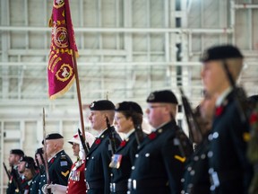 Saskatchewan Dragoons stand with the unit's new guidon, top left, now featuring the Afghanistan Battle Honour. The guidon was unveiled during a Guidon Consecration ceremony held at 15 Wing Moose Jaw on Nov. 3, 2018.