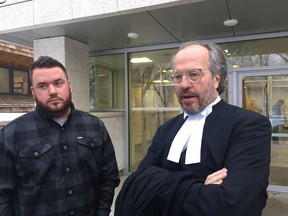 Landon J. Gartner, left, and his lawyer, Ron Piche stand outside Saskatoon Court of Queen's Bench on Friday, Nov. 30, 2018 after a judge acquitted Gartner of dangerous driving causing death in connection with the June 5, 2016 motorcycle crash that killed his girlfriend, 28-year-old Lindsay Facca.