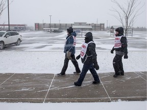 Saskatoon Co-op employees walk a picket line outside of the Co-Op gas station and grocery store on 33rd Street West in Saskatoon on Nov. 5, 2018.